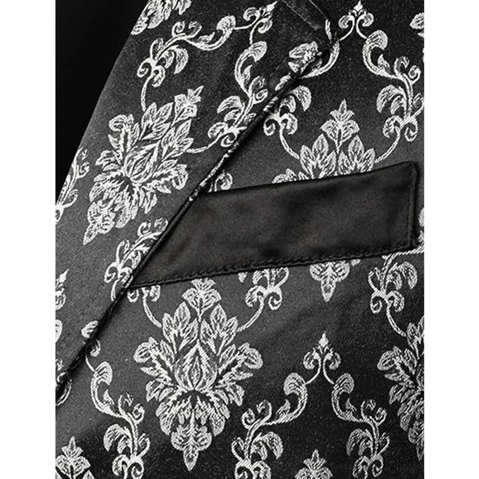 Close-up detail of steampunk vest showing damask floral texture and satin breast pocket flap craftsmanship