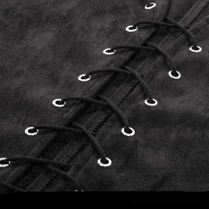 Close-up detail of steampunk vest lace-up closure with silver metal eyelets and black lacing cords on suede fabric