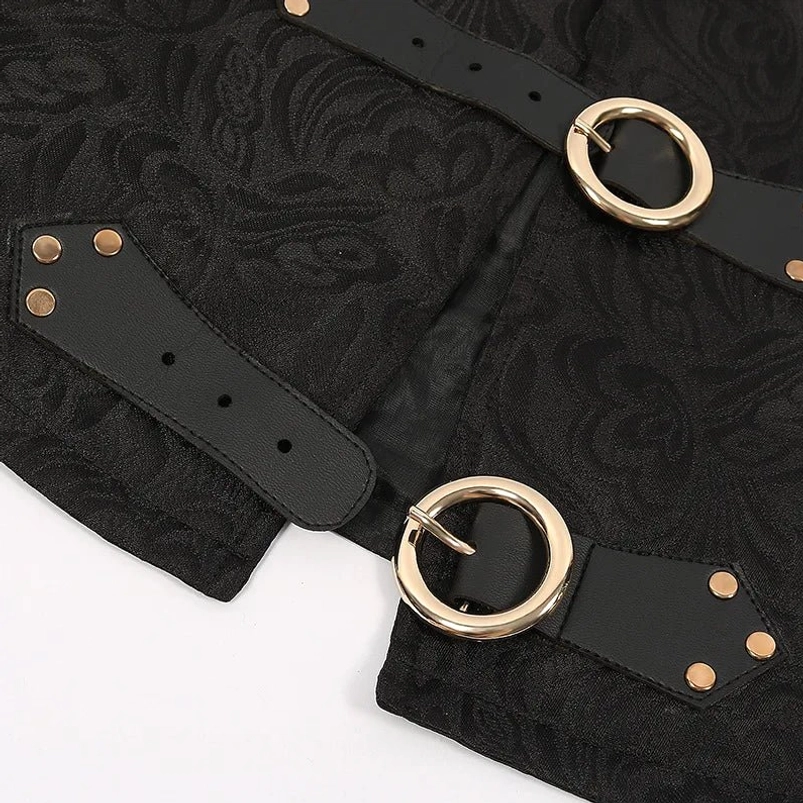 Close-up detail of steampunk vest front metal buckles with copper rivets and decorative rings