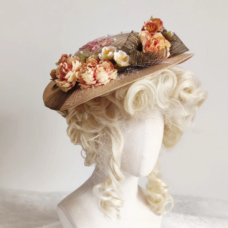 Steampunk Victorian formal floral hat front three-quarter view with woven straw fabric, flower clusters, and pleated brown fabric trim on mannequin