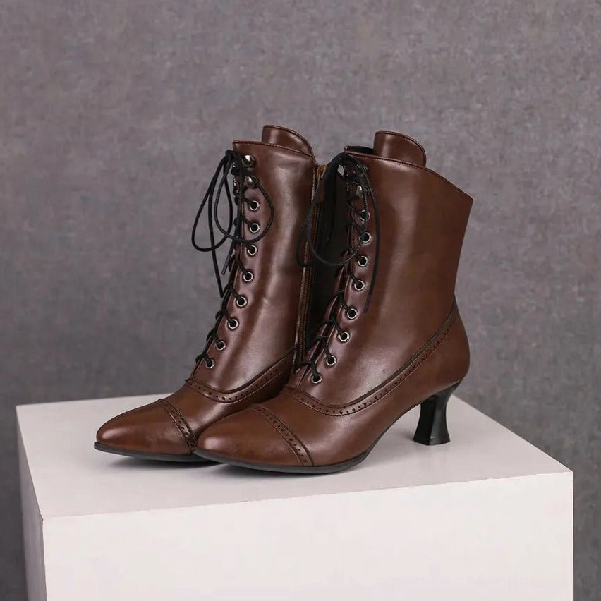 Steampunk Victorian brown leather lace-up ankle boots with metal eyelets and kitten heel - front studio view