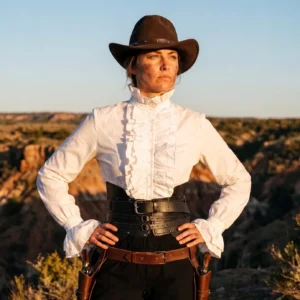 white steampunk victorian ruffle blouse stand collar button-front shirt with ruffled cuffs worn by model in outdoor canyon landscape