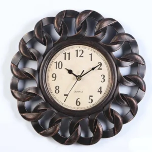Dark bronze steampunk clock with ornate flower border, classic Arabic numeral dial, and weathered industrial finish