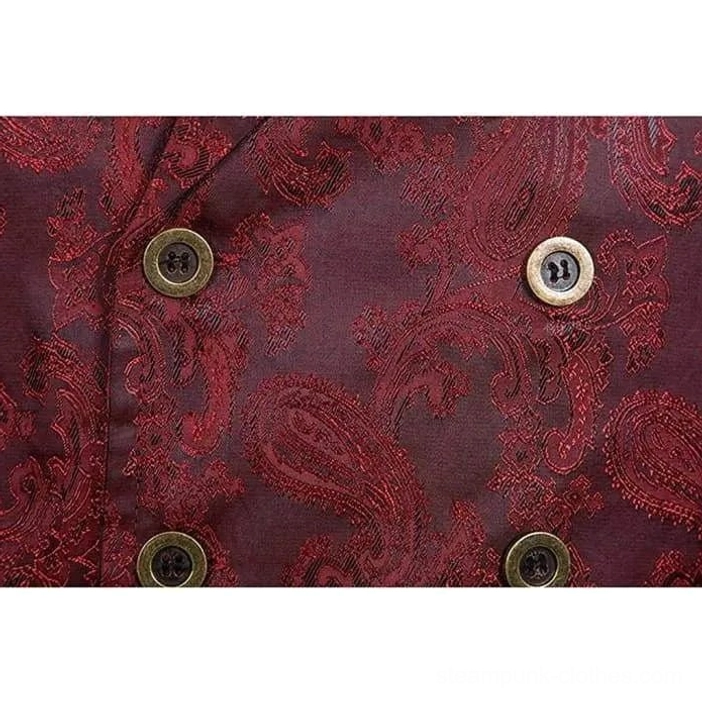 Antique bronze double-row button close-up on red steampunk waistcoat front, showing oxidized metallurgical finish and matching paisley jacquard fabric beneath