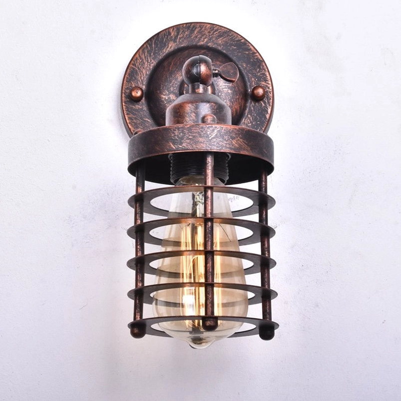 Steampunk wall lamp direct front view displaying circular metal base, multi-bar protective cage design, and vintage Edison-style filament bulb