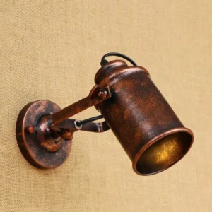 Single-head steampunk wall lamp, side three-quarter angle showcasing distressed bronze iron construction and adjustable mounting joint mechanism