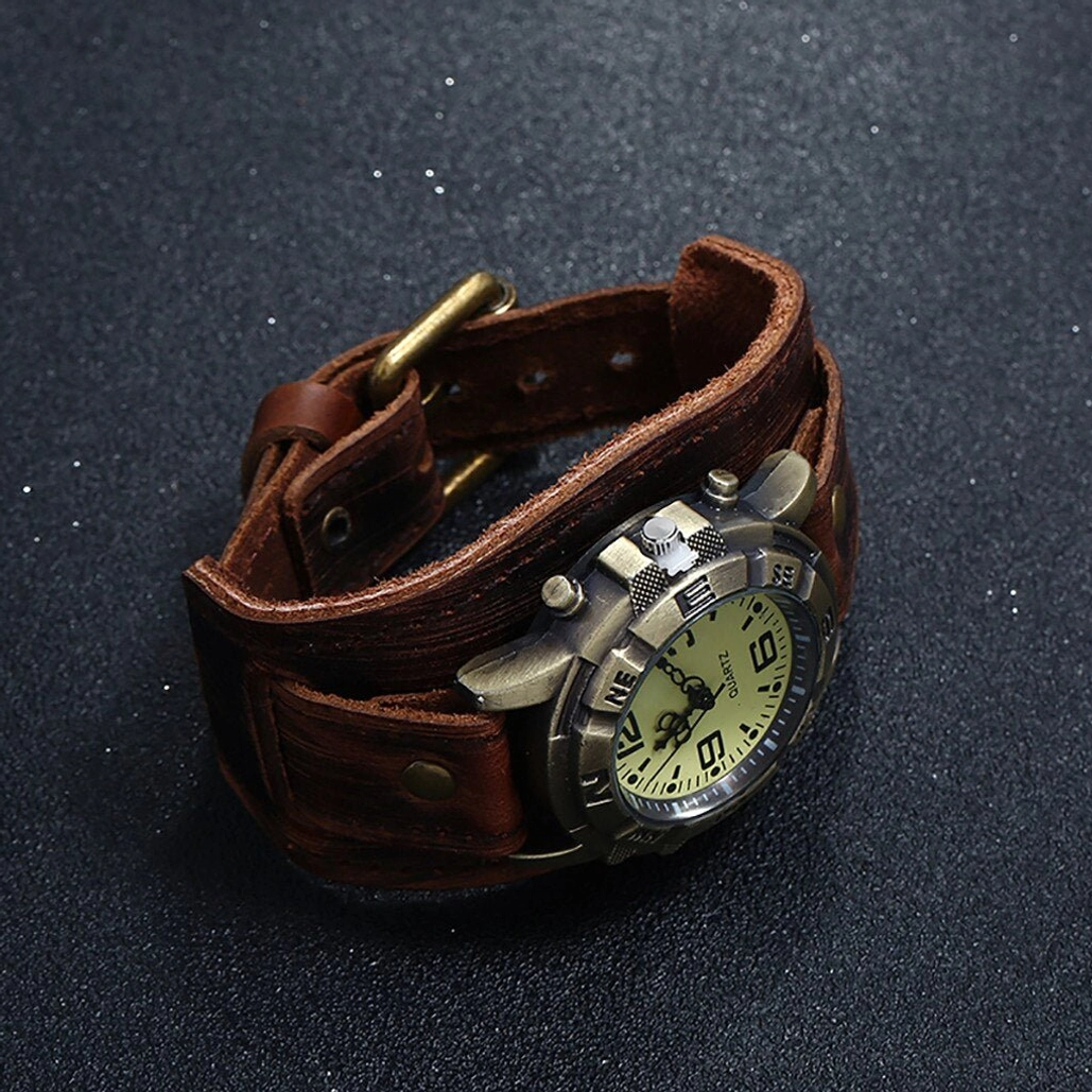 Side profile of steampunk leather watch displaying bronze buckle, exposed watch case details, and authentic distressed leather texture