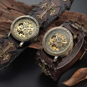 Two steampunk mechanical watches displaying bronze exposed movements and cross-detailed leather straps, comparative view showing design details and craftsmanship