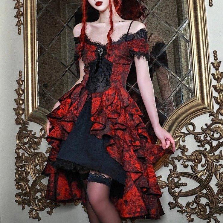Victorian steampunk wedding dress detail view featuring brooch, off-shoulder lace sleeves, high-low ruffle skirt, and black lace thigh-highs