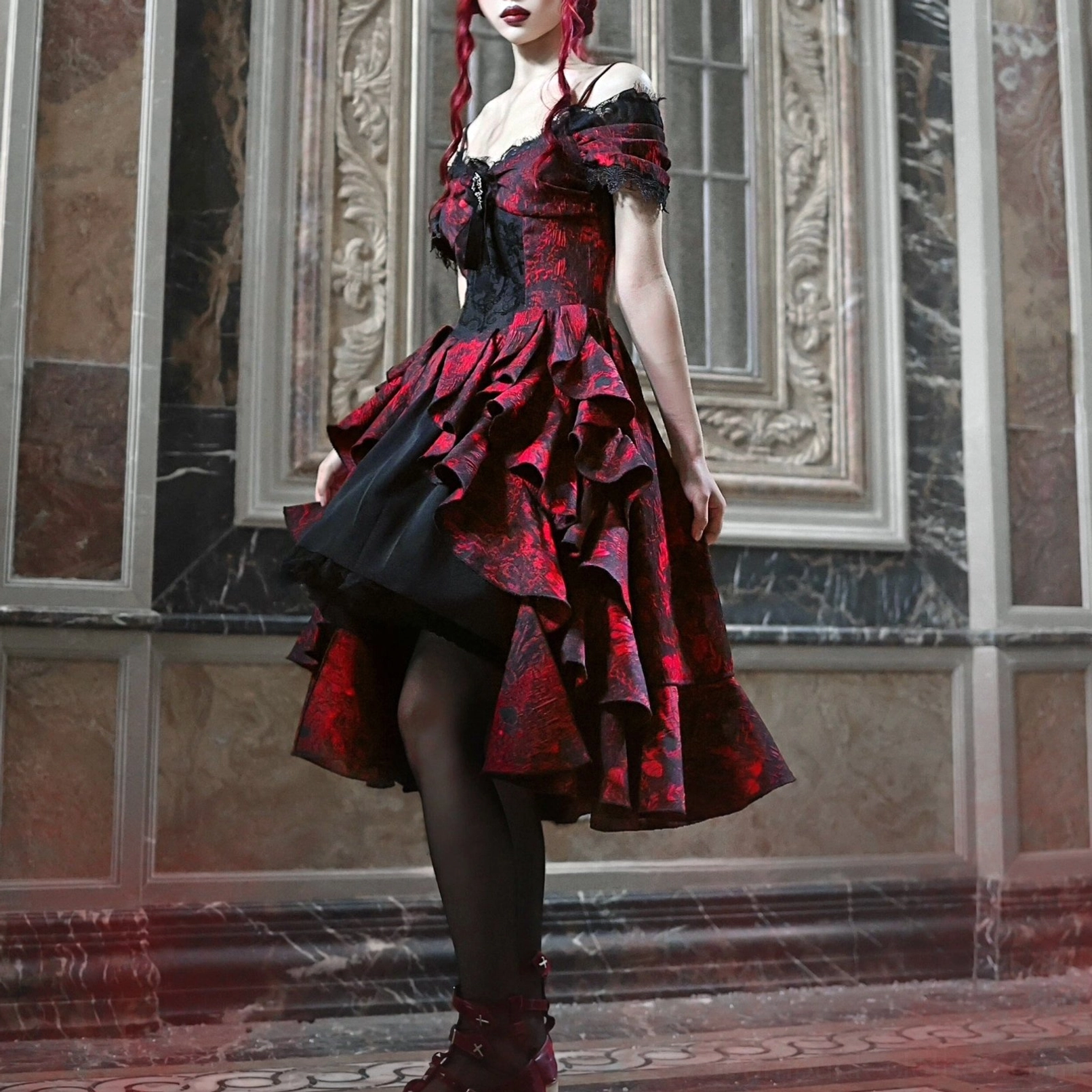 Steampunk bridal gown side profile showing layered ruffle skirt, black tulle underlayer, lace-trimmed stockings, and burgundy gothic boots