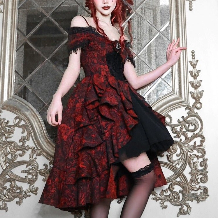 Gothic steampunk wedding dress three-quarter front angle highlighting red-black jacquard pattern, black tulle layers, and lace-trimmed details