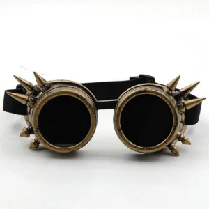 Steampunk spiked welding goggles flat lay front view, antique bronze finish with sharp metal spikes and black elastic head strap