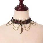Steampunk wing lace choker necklace front view with bronze wing pendant and layered chains on fabric mannequin