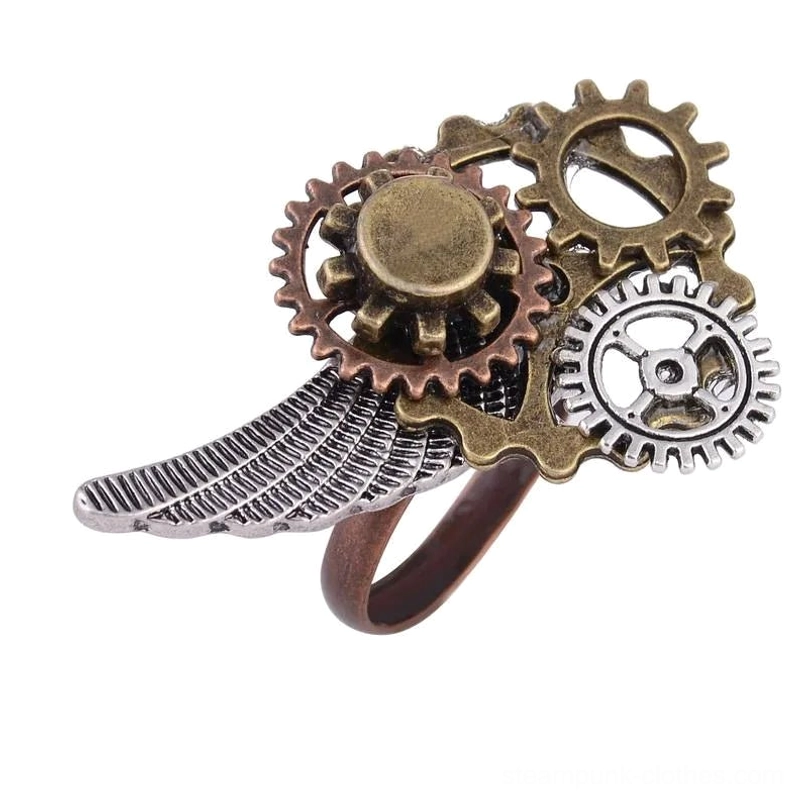 Top-down view of steampunk wing ring showcasing layered gear mechanism and textured silver wing design - vintage metal tones close-up