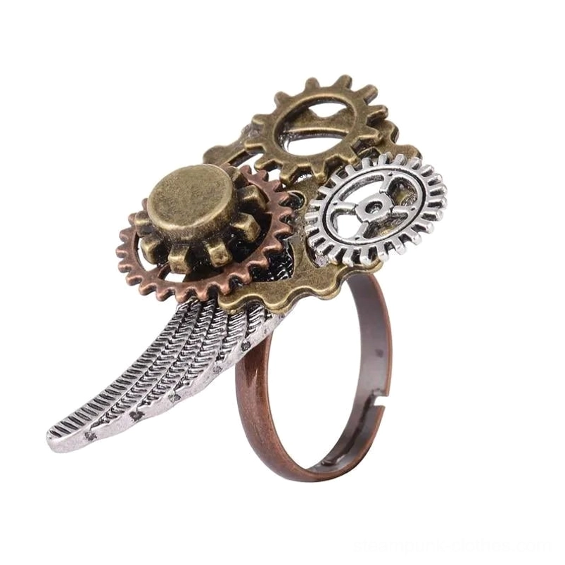 Steampunk wing ring in oblique angle showing vintage mixed metal finish, gear decoration, and striped wing texture on clean white background - industrial jewelry detail
