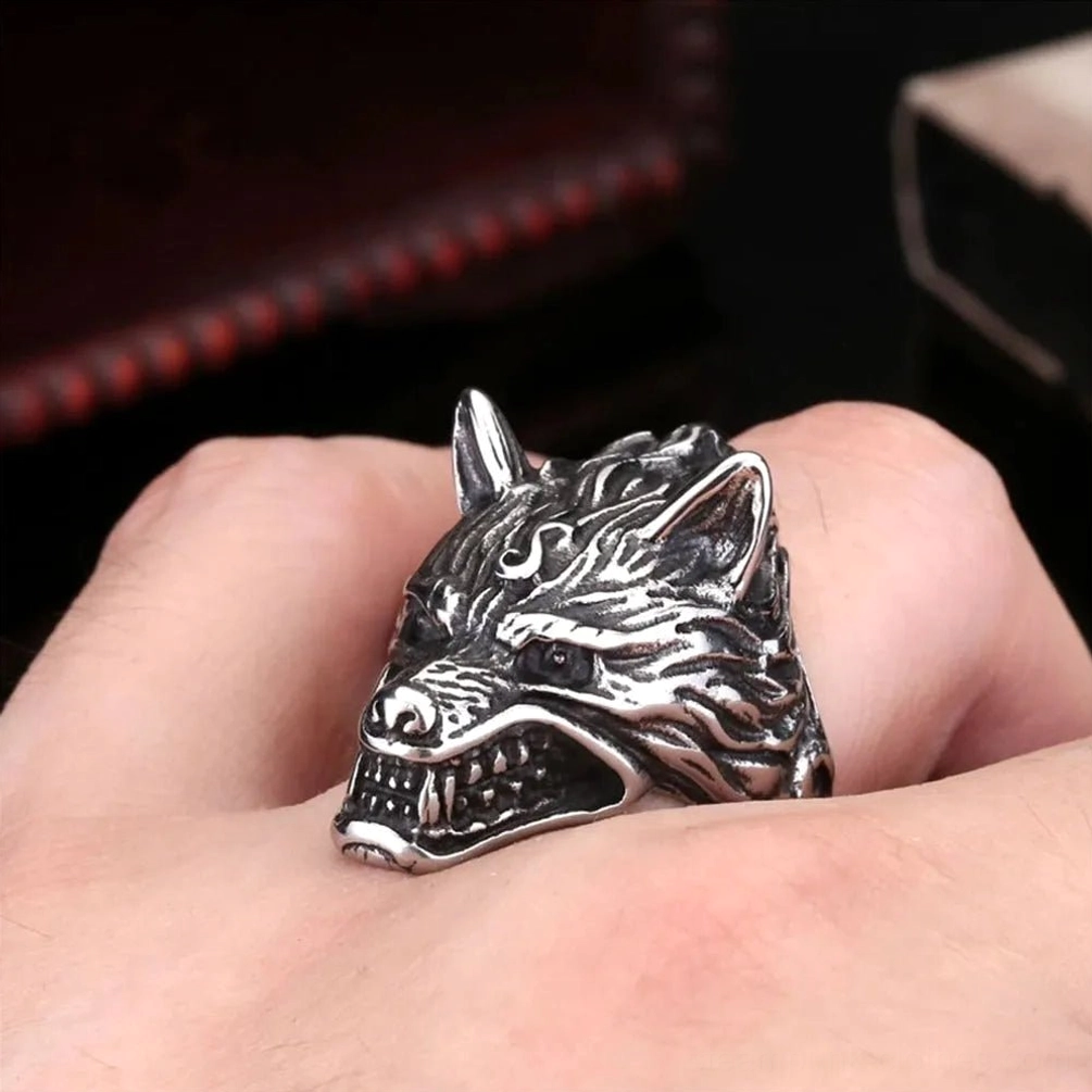 Detailed view of wolf ring featuring sharp teeth and pointed ears, vintage steampunk aesthetic with red leather gift box