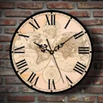 Steampunk vintage world map wall clock featuring aged beige dial with black Roman numerals and ornate clock hands, displayed against industrial brick wall background