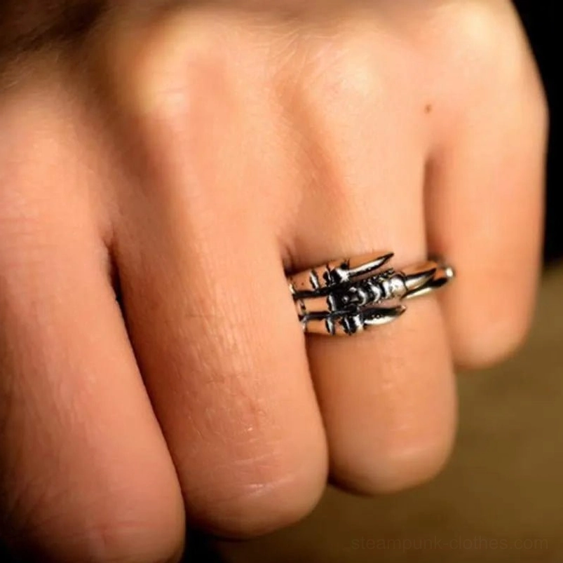 Sterling silver eagle claw steampunk ring front view on male hand with dark vintage finish