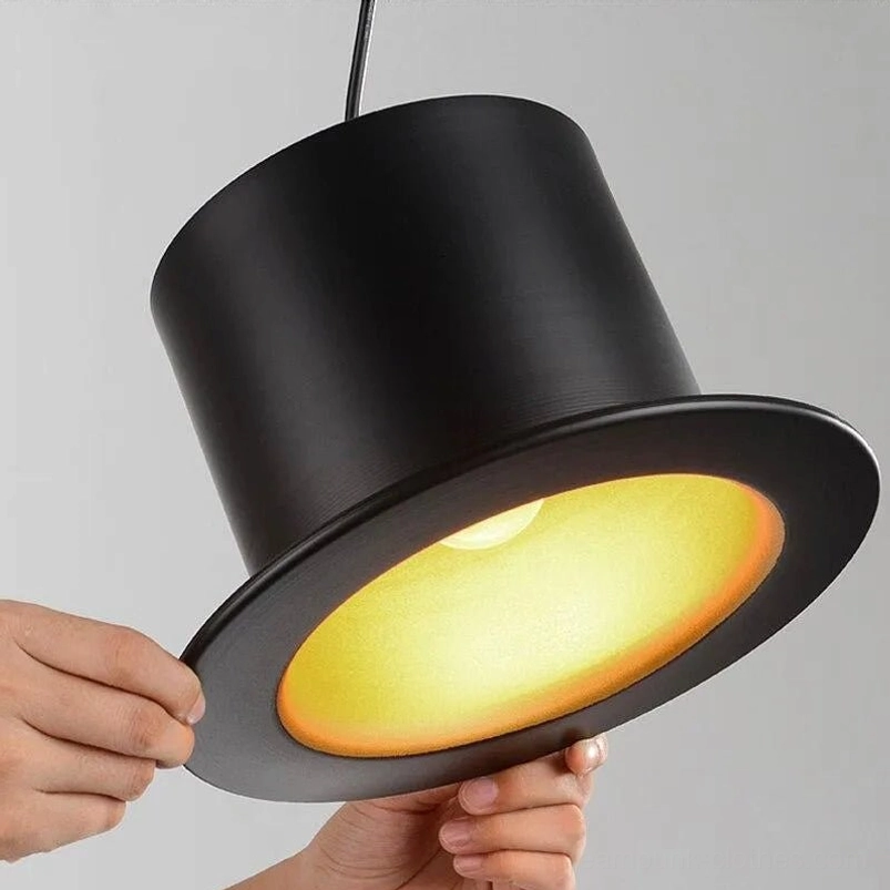 Close-up detail of top hat steampunk lamp showing wide brim, matte black metal finish, and gold interior surface