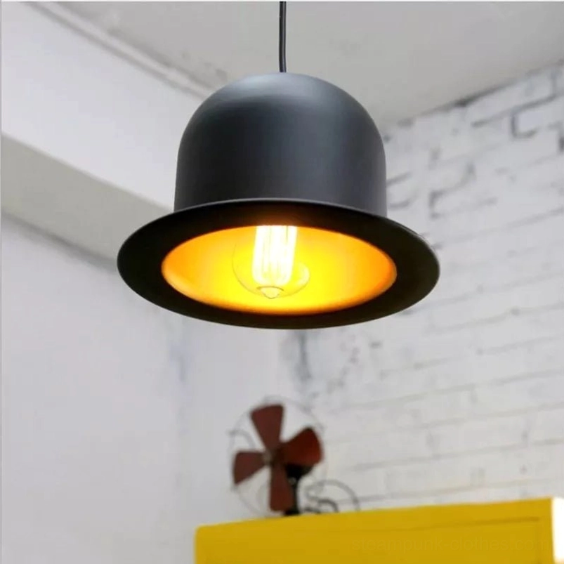 Top hat steampunk pendant lamp with matte black exterior and warm gold interior glow, industrial home décor display