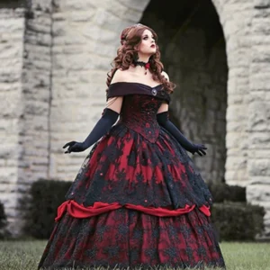 Victorian ball gown back three-quarter view showing structured corset bodice and layered skirt with red satin accents