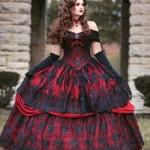 Burgundy Victorian off-shoulder ball gown with black lace overlay, front three-quarter view with model wearing long black opera gloves