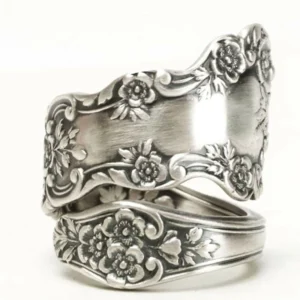 Victorian floral engraved adjustable silver ring front three-quarter angle view displaying matte silver plating and full-surface ornate floral relief carvings for steampunk gothic jewelry