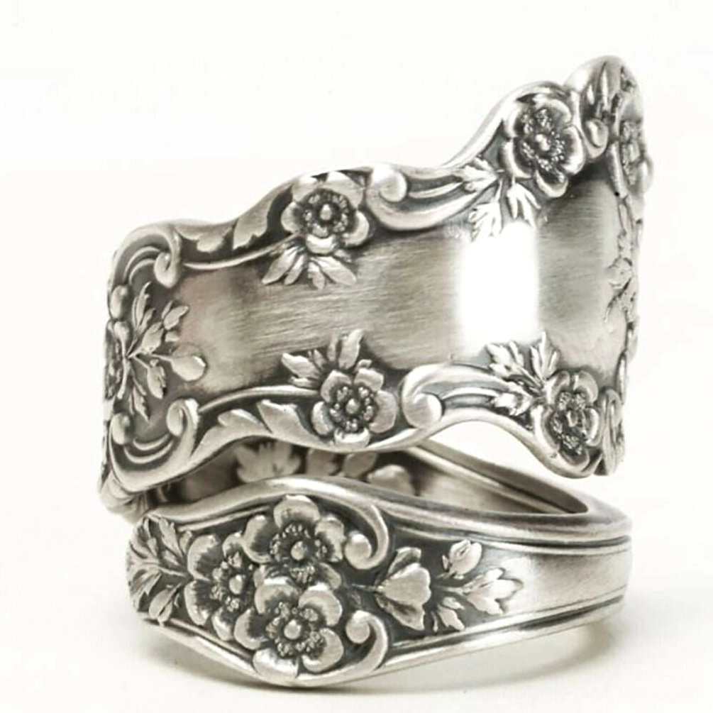 Victorian floral engraved adjustable silver ring front three-quarter angle view displaying matte silver plating and full-surface ornate floral relief carvings for steampunk gothic jewelry