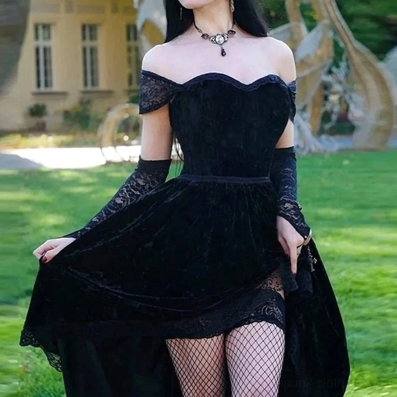 Victorian gothic black velvet dress with lace sleeves, fishnet stockings and pendant necklace, outdoor garden setting