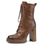 Distressed brown leather Victorian lace-up platform boots with side zipper, flat front view on white background