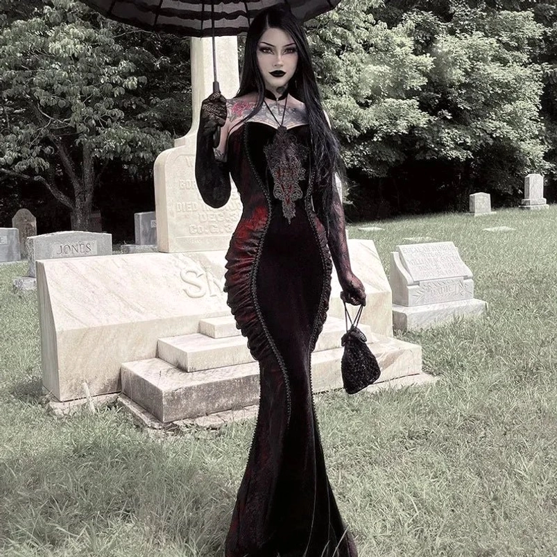 Black red Victorian strapless mermaid dress front view, worn by tattooed woman with long black hair in gothic cemetery setting, featuring lace bust trim, velvet panels, and matching long gloves