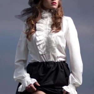 white steampunk ruffle formal blouse close-up showing detailed ruffled neckline cuffs and front placket trim