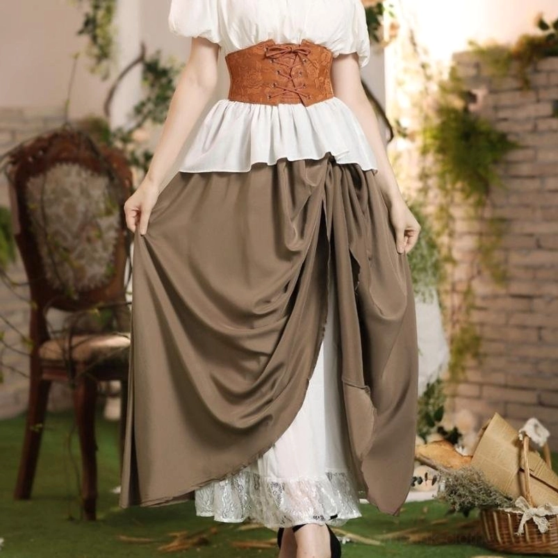 Victorian steampunk skirt outfit on female model in brick courtyard setting, rear view showing draped layers, corset waist belt, and white ruffled blouse combination