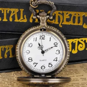 Opened quartz pocket watch displaying white dial with black numerals and flip-open cover featuring detailed relief artwork