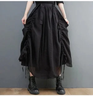 Oversized black steampunk drawstring skirt front view with voluminous silhouette and elastic waist