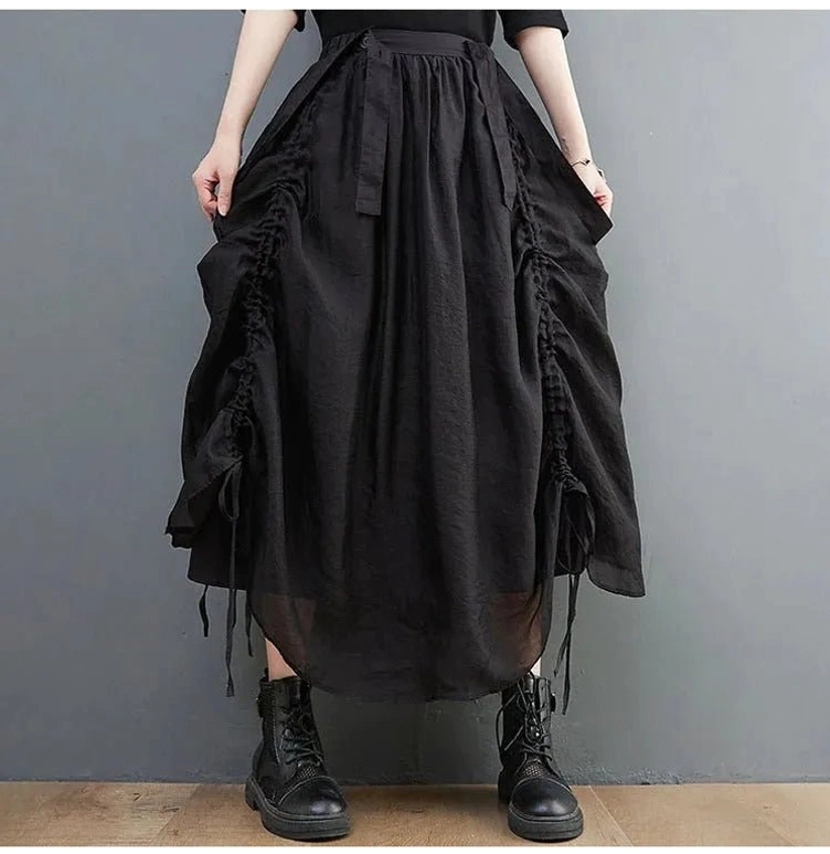 Oversized black steampunk drawstring skirt front view with voluminous silhouette and elastic waist
