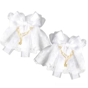 White lace steampunk wrist cuffs with ruffled lace trim, sheer bow, and gold star pendant chain in flat lay styling against plain background