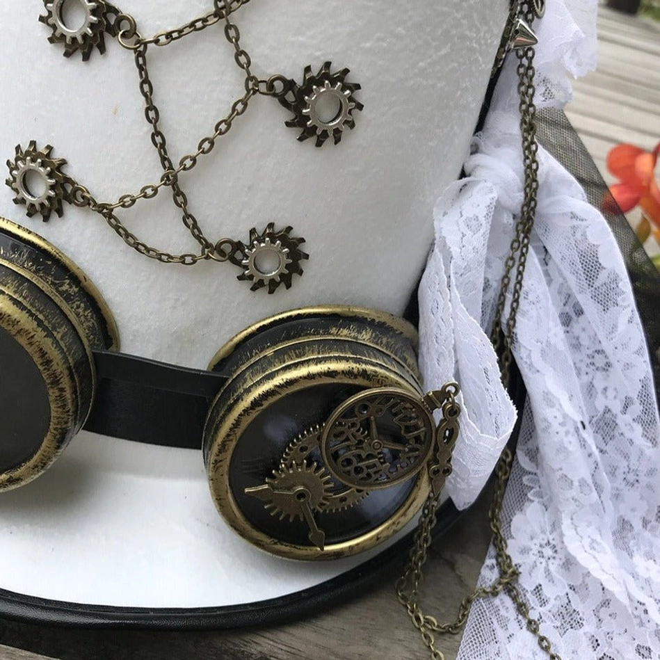 Close-up detail of white steampunk top hat showing intricate brass gear chains and delicate lace trim, side angle shot on outdoor wooden deck