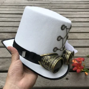 Steampunk white top hat with vintage brass goggles and black hat band held in hand, side profile outdoor shoot with wooden deck and floral background