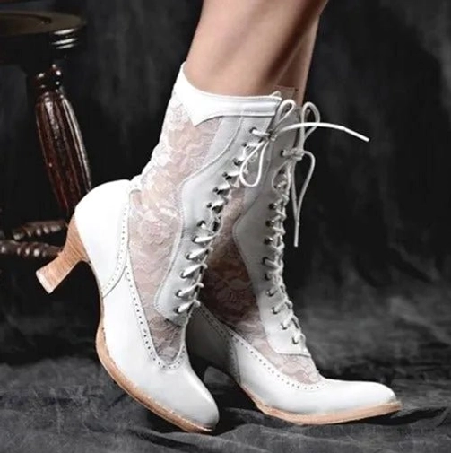 White Victorian lace-up steampunk boots with delicate lace and leather detailing, wooden kitten heel, front lacing design