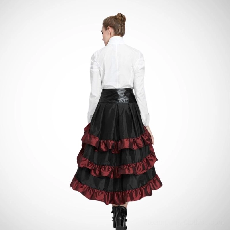 Back view of wine-red steampunk high-low bustle skirt worn with white blouse and black ankle boots showing rear silhouette and hemline drama