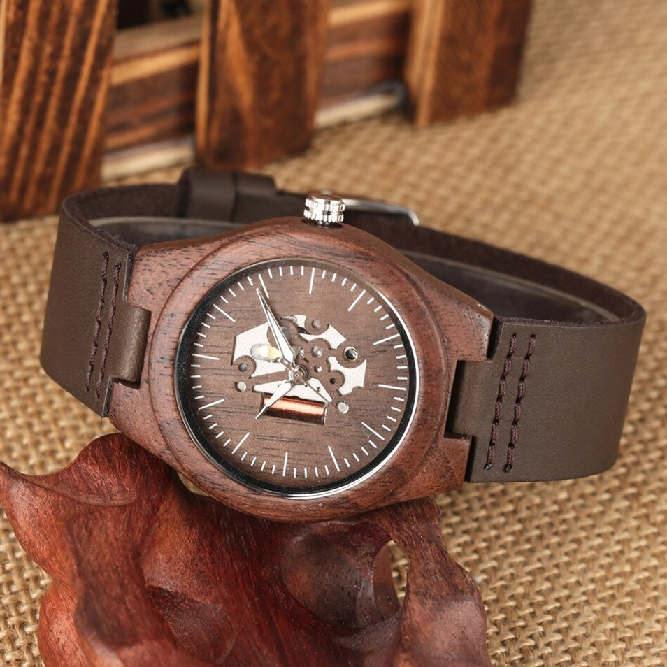 Mechanical wooden watch oblique side view with stitched leather band, walnut case, and visible gearwork dial design