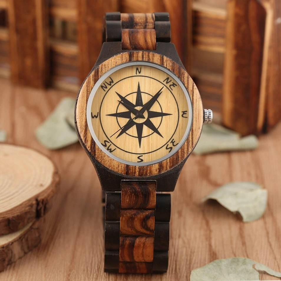 Wooden compass wristwatch straight front view with contrasting dark and light wood grain texture on round compass dial face