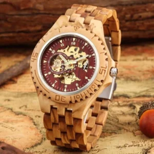 Light brown zebrawood steampunk watch with red skeleton dial, gold exposed movement, front three-quarter view on vintage map backdrop