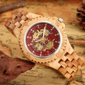 Tan zebrawood mechanical steampunk watch with fluted bezel and red skeleton dial, side view showcasing band craftsmanship